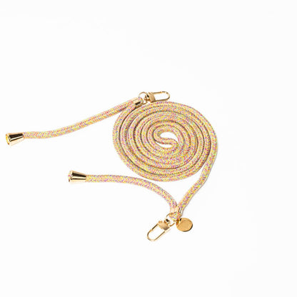 Pastel pink, yellow and purple patterned Multi Colorful PHONE CORD coiled with gold-tone hardware on white.