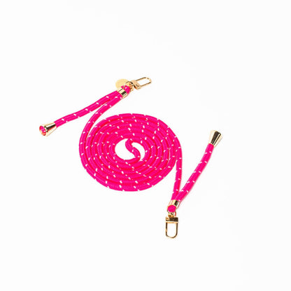 Hot pink Multi Colorful PHONE CORD with a white dot pattern, coiled with gold-tone hardware on white.