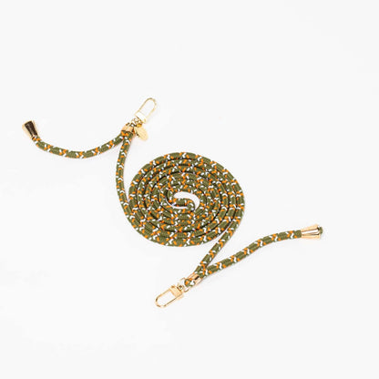 Olive, orange and white patterned Multi Colorful PHONE CORD coiled with gold-tone hardware on white.