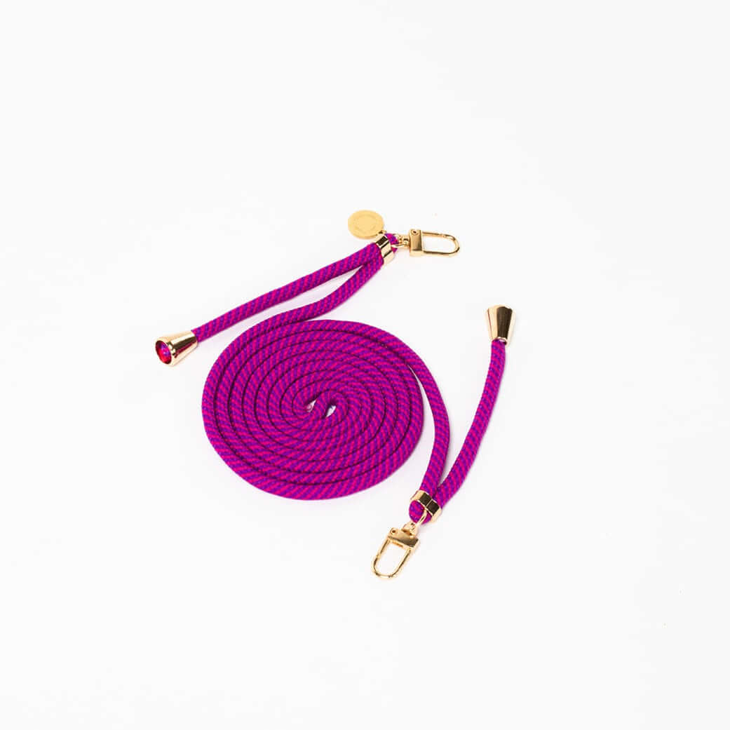 Magenta and purple striped Multi Colorful PHONE CORD coiled with gold-tone hardware on a white background.