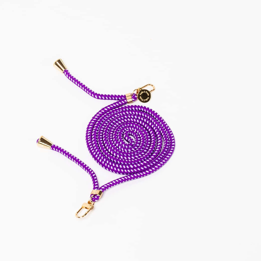 Purple Multi Colorful PHONE CORD with a white dot pattern, coiled with gold-tone hardware on a white background.