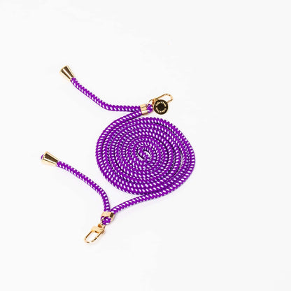 Purple Multi Colorful PHONE CORD with a white dot pattern, coiled with gold-tone hardware on a white background.