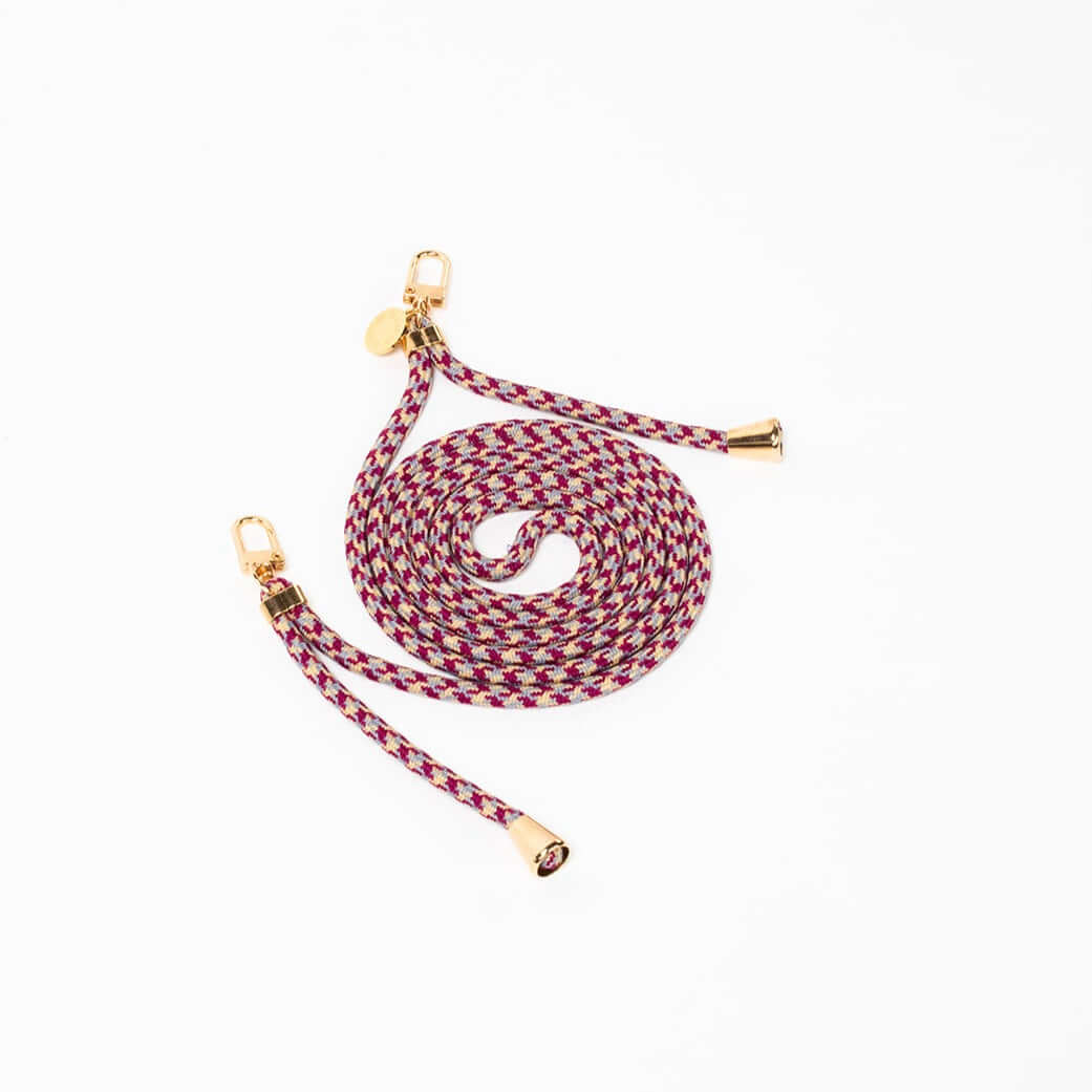 Burgundy, gray and cream patterned Multi Colorful PHONE CORD shown at a different angle, gold-tone hardware on white.