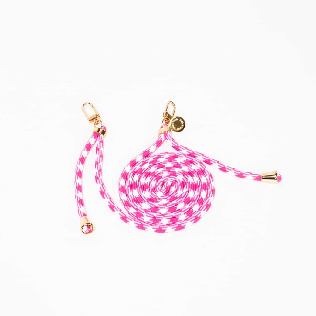 Hot pink and white patterned Multi Colorful PHONE CORD coiled with gold-tone hardware on a white background.