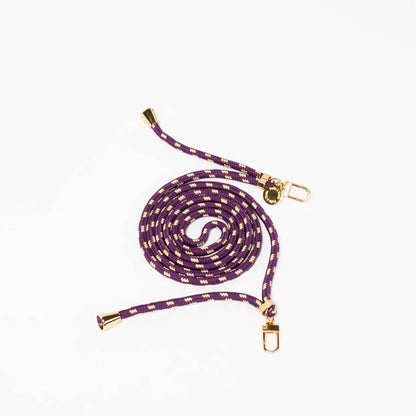 Purple and cream dashed Multi Colorful PHONE CORD coiled with gold-tone hardware on a white background.