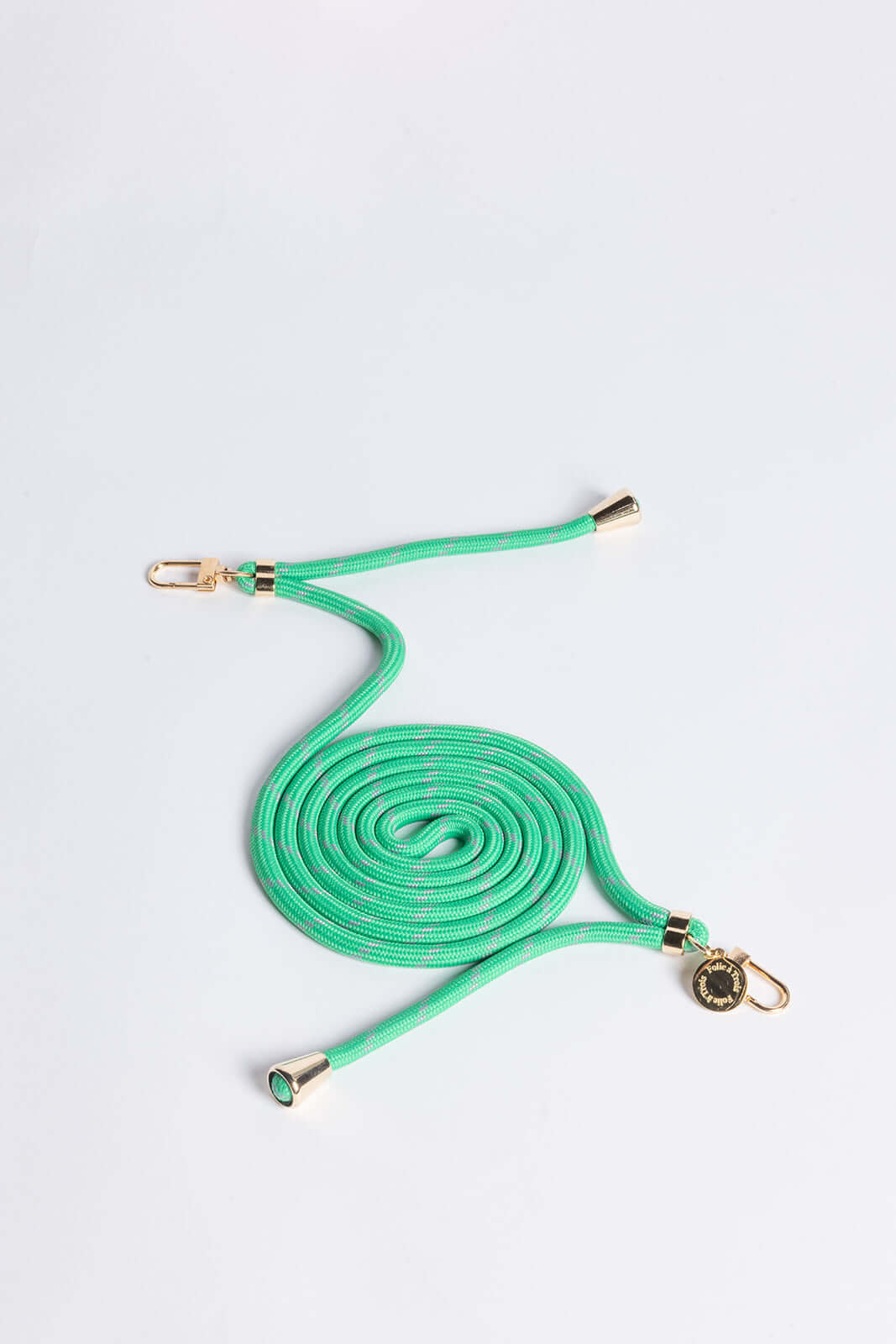 Mint green and gray patterned Multi Colorful PHONE CORD coiled with gold-tone hardware on a white background.
