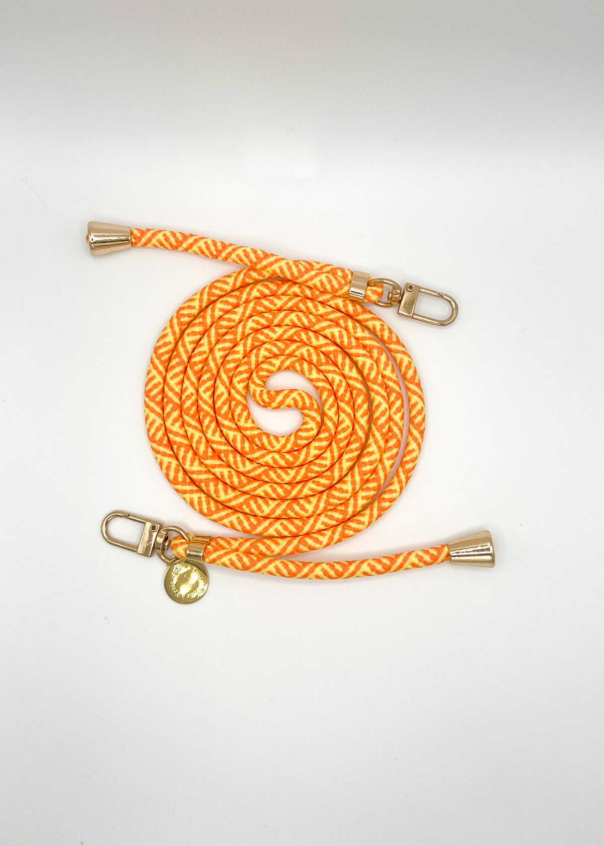 Orange and yellow patterned Multi Colorful PHONE CORD coiled with silver-tone hardware on a white background.