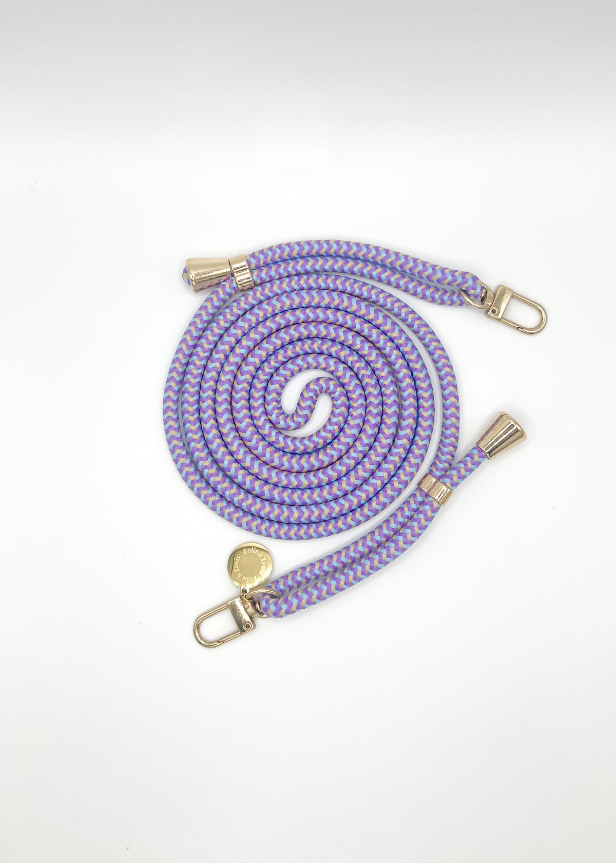 Lavender, pink and tan patterned Multi Colorful PHONE CORD coiled with gold-tone hardware on white.