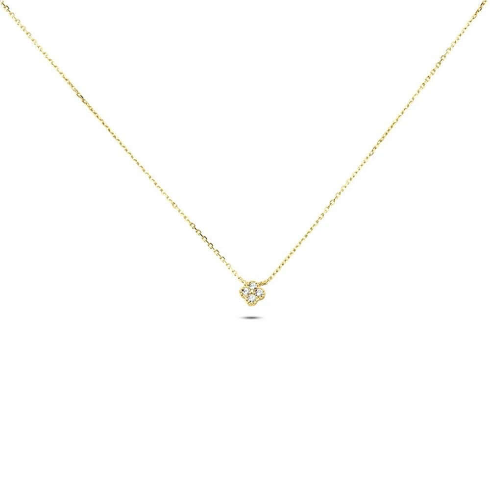 The Nessa NECKLACE in gold, a small clover-shaped cluster of clear cubic zirconia stones on a fine chain, shown flat.
