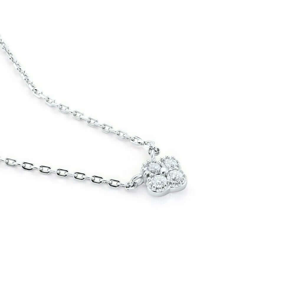 The Nessa NECKLACE in silver, a close-up angled view of the clover-shaped cubic zirconia cluster on its fine chain.