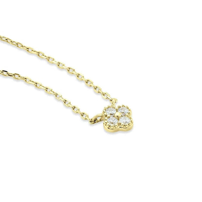 The Nessa NECKLACE in gold with clear stones, a close-up angled view of the clover-shaped cluster on its fine chain.