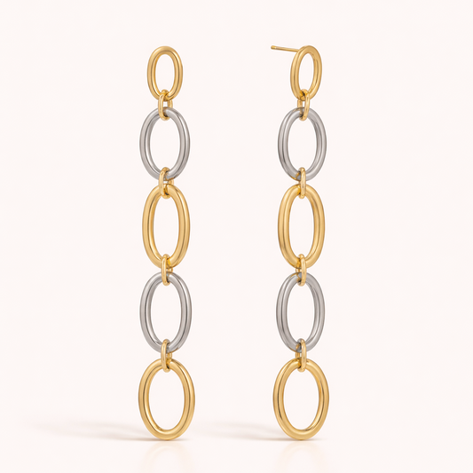 The No Apologies EARRINGS drop in a long chain of five alternating gold and silver oval links in a row.