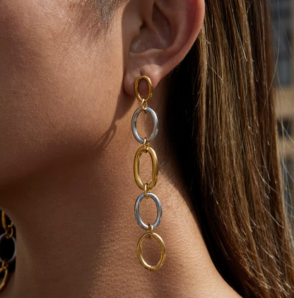In close-up profile, the No Apologies EARRINGS trail their two-tone link chain gently beside the ear.