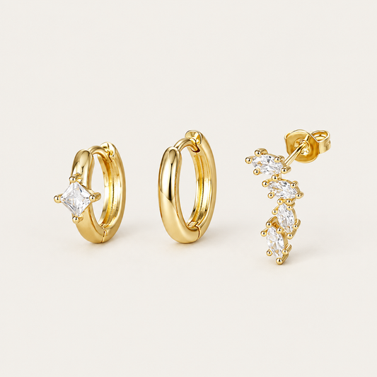 Three gold Folie à Trois Odile SET pieces: a plain hoop, a hoop set with a square crystal, and a marquise climber stud.