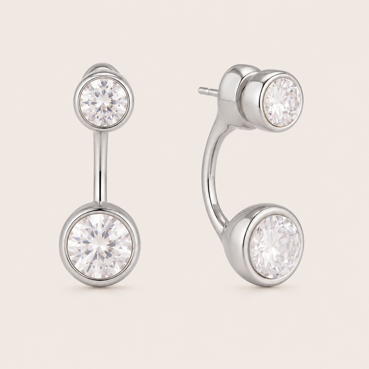 Silver ear-jacket stud earring with two round bezel-set white zirconia stones linked by a slender bar — Folie à Trois Ondine EARRINGS.
