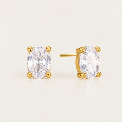 Gold Ovalie EARRINGS: oval-cut white zirconia studs in a four-prong gold setting — Folie à Trois wholesale jewelry
