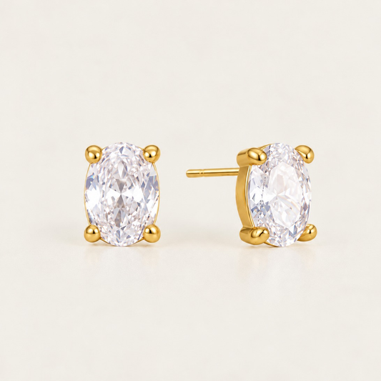 Gold Ovalie EARRINGS: oval-cut white zirconia studs in a four-prong gold setting — Folie à Trois wholesale jewelry