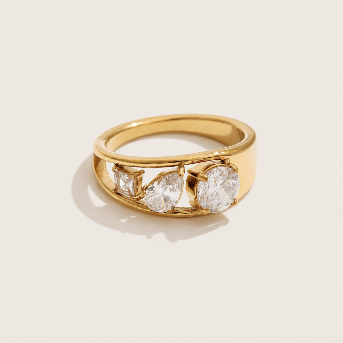 Gold ring with three graduated white zirconia stones in mixed cuts set along a wide band — Folie à Trois Pavé Line RING