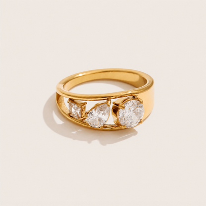 Gold ring with three graduated white zirconia stones in mixed cuts set along a wide band — Folie à Trois Pavé Line RING