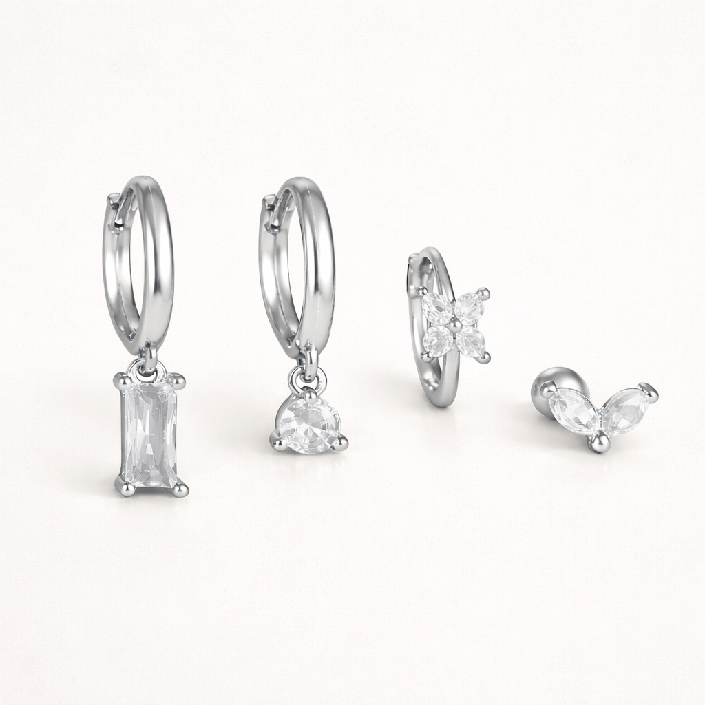 In silver tone, Perfect Earparty SET displays its baguette, teardrop, clover, and marquise stone pieces.