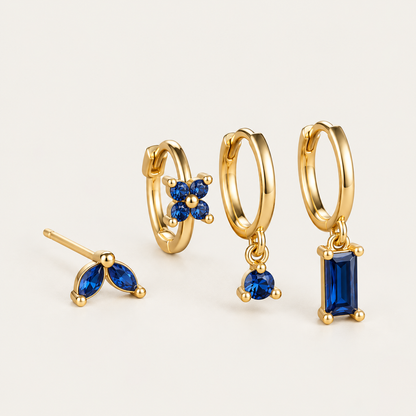 Perfect Earparty SET in gold with sapphire blue stones: marquise stud, flower huggie, round drop hoop and baguette drop hoop