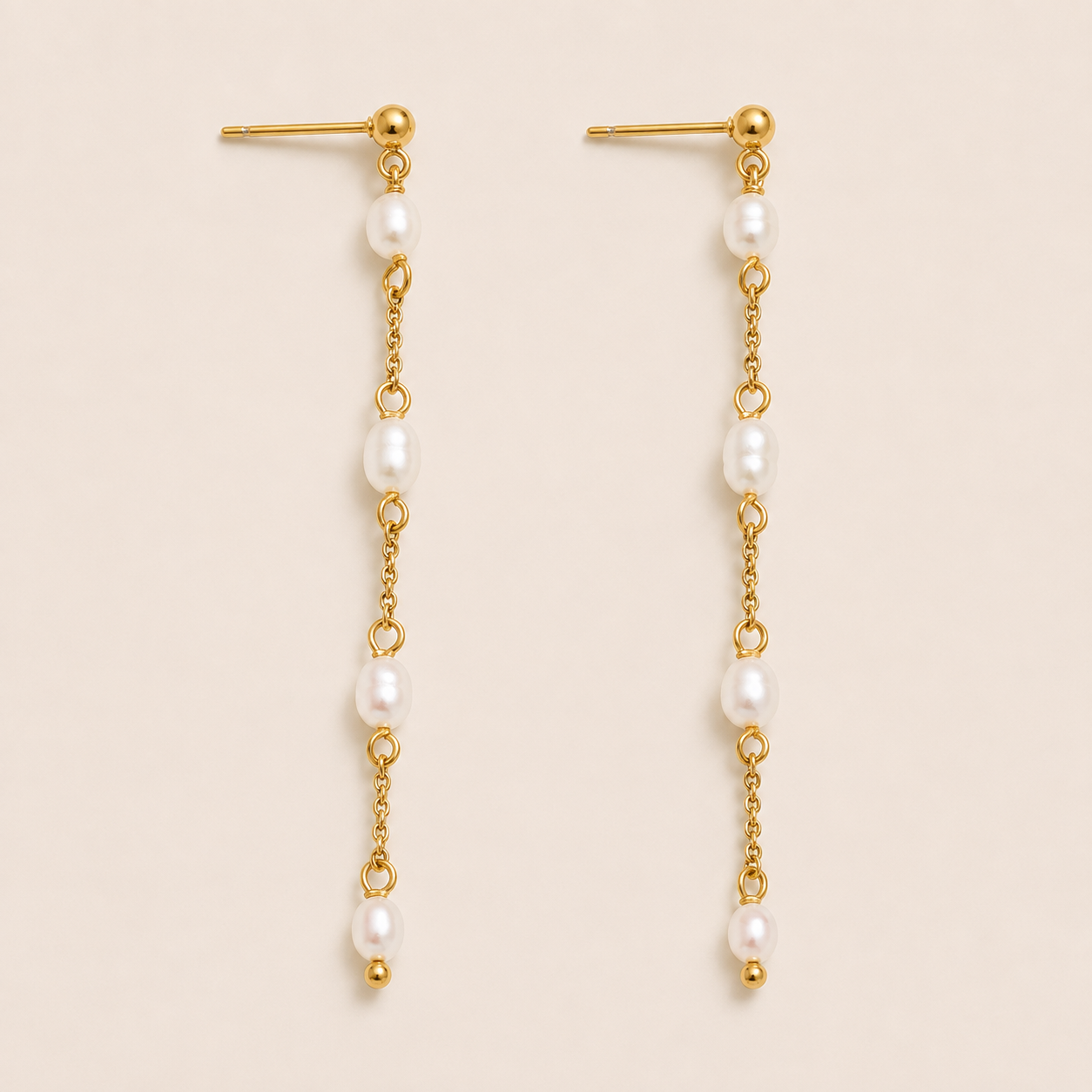 Long gold chain drop earring with four freshwater pearls spaced along a delicate link — Folie à Trois Perla Luna EARRINGS.