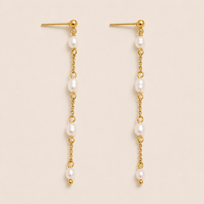 Long gold chain drop earring with four freshwater pearls spaced along a delicate link — Folie à Trois Perla Luna EARRINGS.