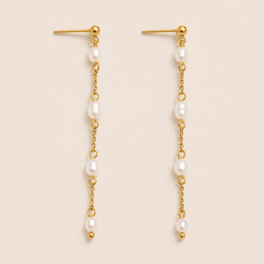 Long gold chain drop earring with four freshwater pearls spaced along a delicate link — Folie à Trois Perla Luna EARRINGS.