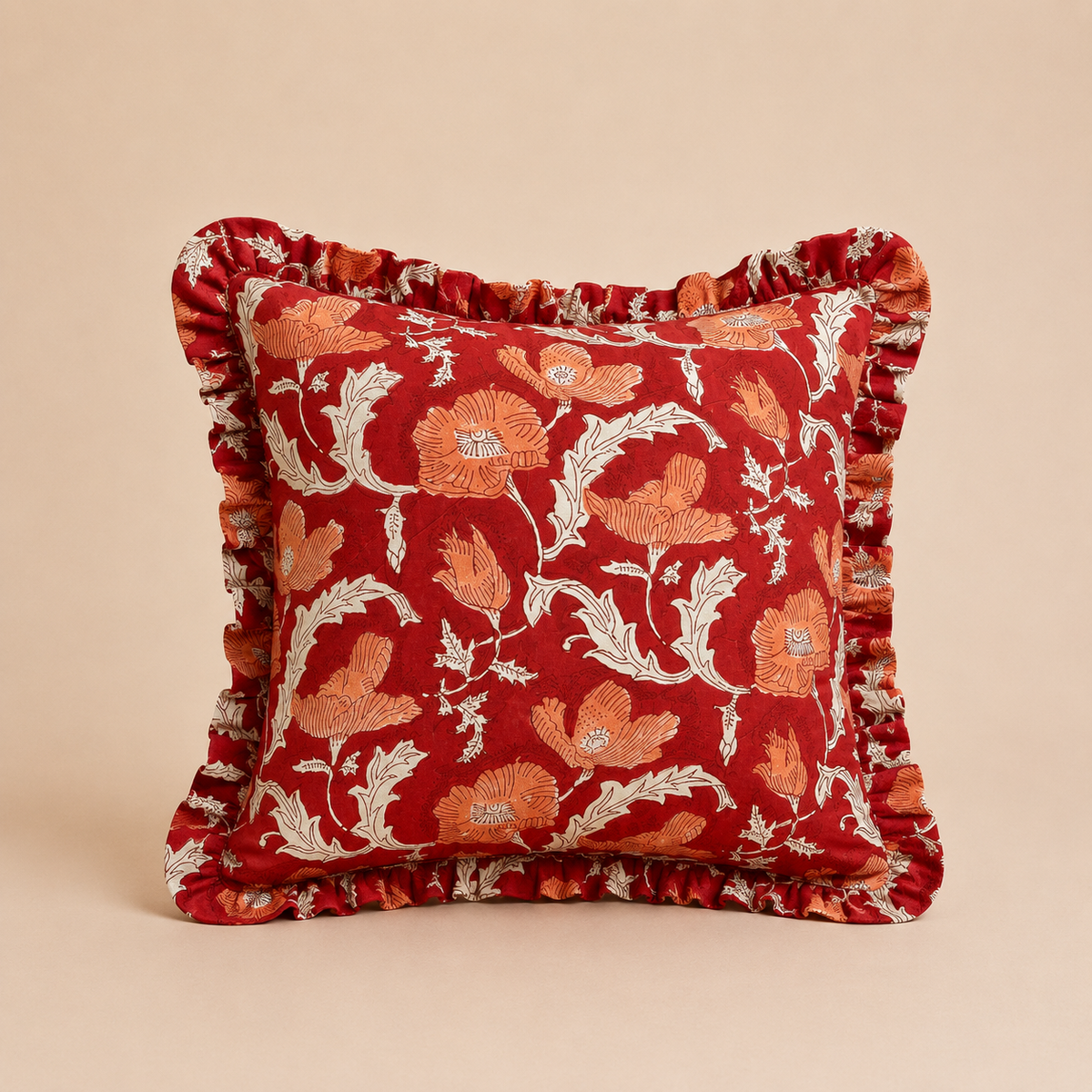 Poppy Flame Square cushion in deep red with a bold orange poppy floral print and cream leaf outlines, finished with a ruffled edge.