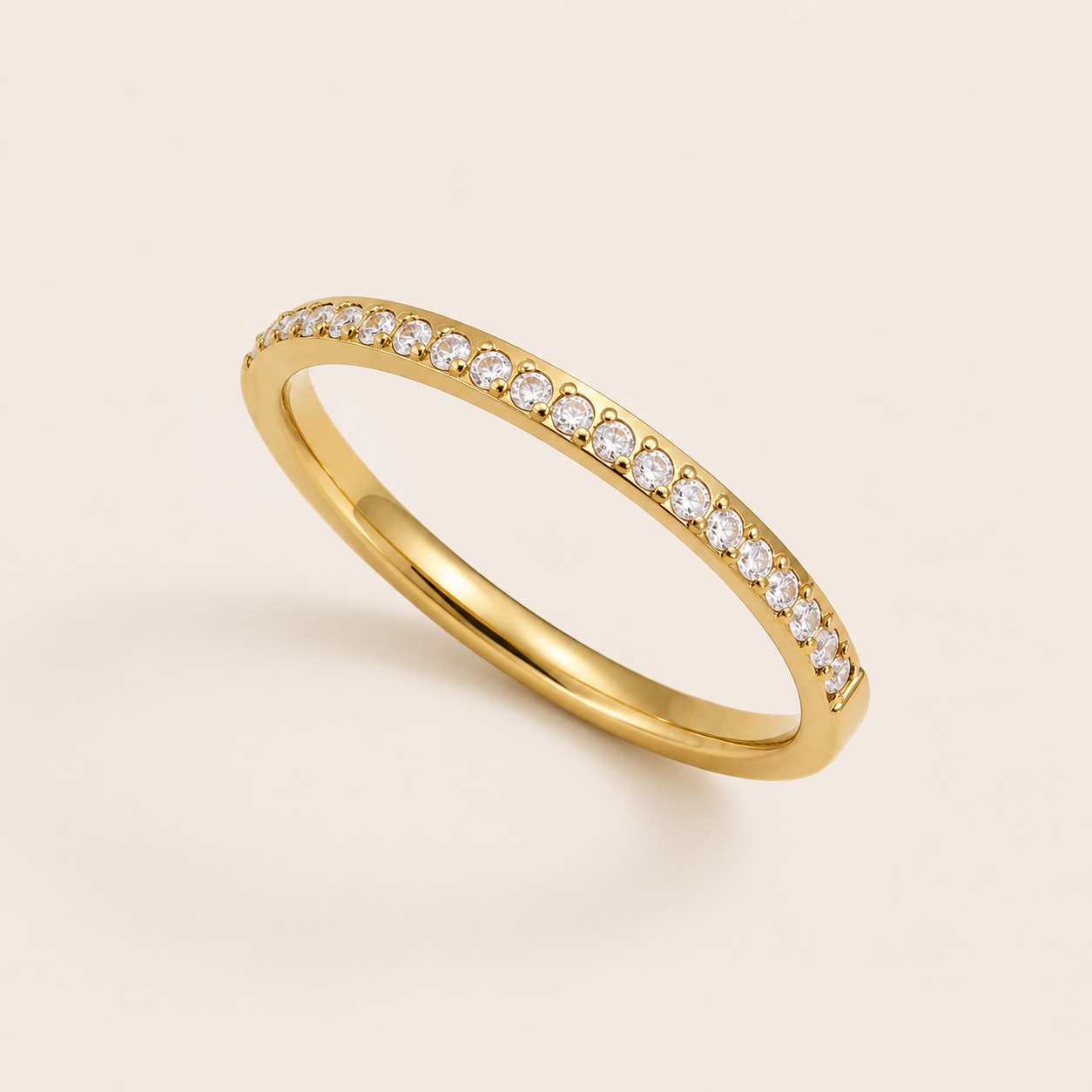 Gold pavé ring set with sparkling white cubic zirconia stones on a cream backdrop — Folie à Trois Prisma RING wholesale stacking ring