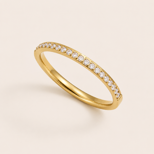 Gold pavé ring set with sparkling white cubic zirconia stones on a cream backdrop — Folie à Trois Prisma RING wholesale stacking ring