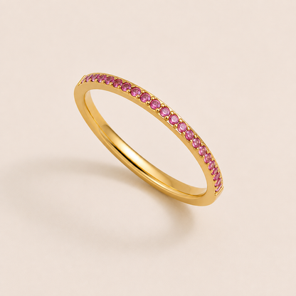 Gold pavé ring set with sparkling pink cubic zirconia stones on a cream backdrop — Folie à Trois Prisma RING wholesale stacking ring