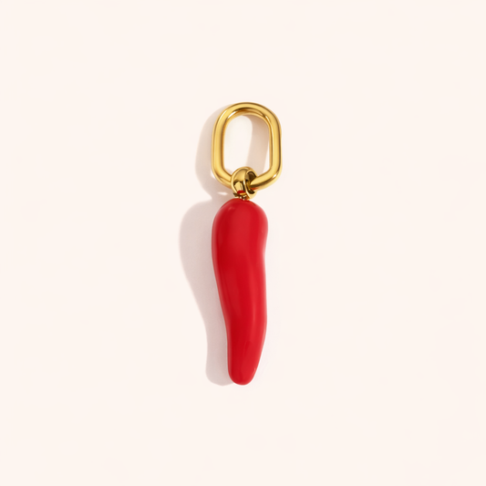 The Red Chili Pepper CHARM in a flat lay, a glossy red enamel chili pendant on a gold paperclip-style connector.
