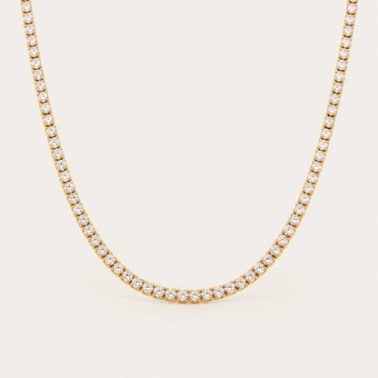 Gold Rivière NECKLACE: a classic tennis necklace lined with sparkling round white zirconia stones — Folie à Trois