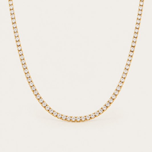 Gold Rivière NECKLACE: a classic tennis necklace lined with sparkling round white zirconia stones — Folie à Trois