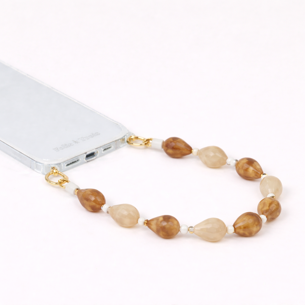 Mixed stone teardrop beaded Romee short phone strap clipped to a clear phone case, full view.