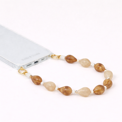 Mixed stone teardrop beaded Romee short phone strap clipped to a clear phone case, full view.