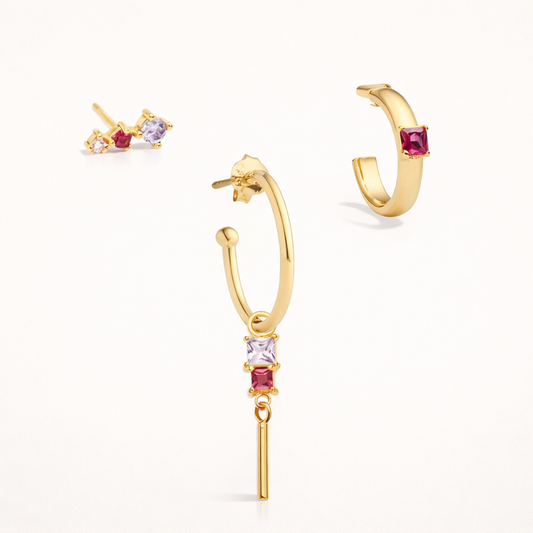 The Rosa SET in gold with lilac and pink square-cut stones, featuring a two-stone stud, a dangle hoop, and a single-stone hoop in studio.