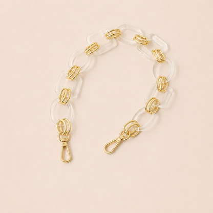 Short clear acrylic link phone chain with gold connectors on cream — Folie à Trois Rowan wholesale phone chain