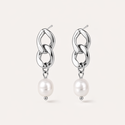 Rule Earrings link two chunky silver curb-chain loops that drop into a smooth freshwater pearl at the base.