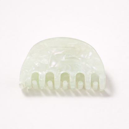 Ruth HAIR CLIP half-moon acetate claw clip in a mint green pearl shade, studio shot.