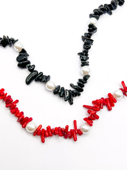Black and red beaded Shell Whisper SHORT PHONE STRAP colorways shown together, close-up of chip beads and pearls.