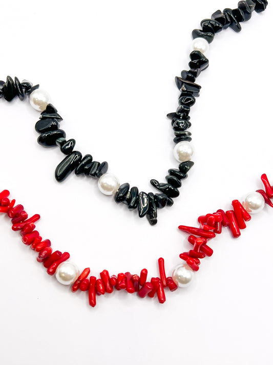 Black and red beaded Shell Whisper SHORT PHONE STRAP colorways shown together, close-up of chip beads and pearls.