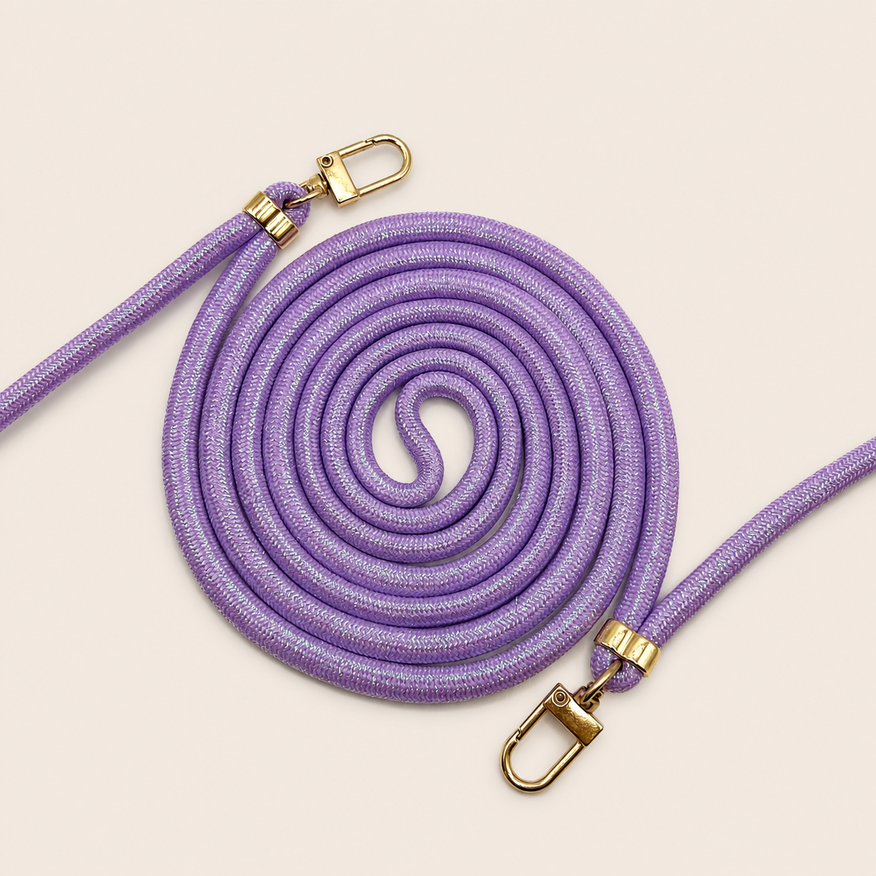 Purple Shimmery PHONE CORD with a metallic sheen, coiled with gold hardware, shown as a flat lay.