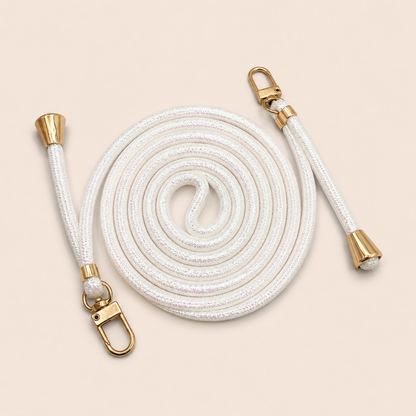 White Shimmery PHONE CORD with a metallic sheen, coiled with gold hardware, shown as a flat lay.