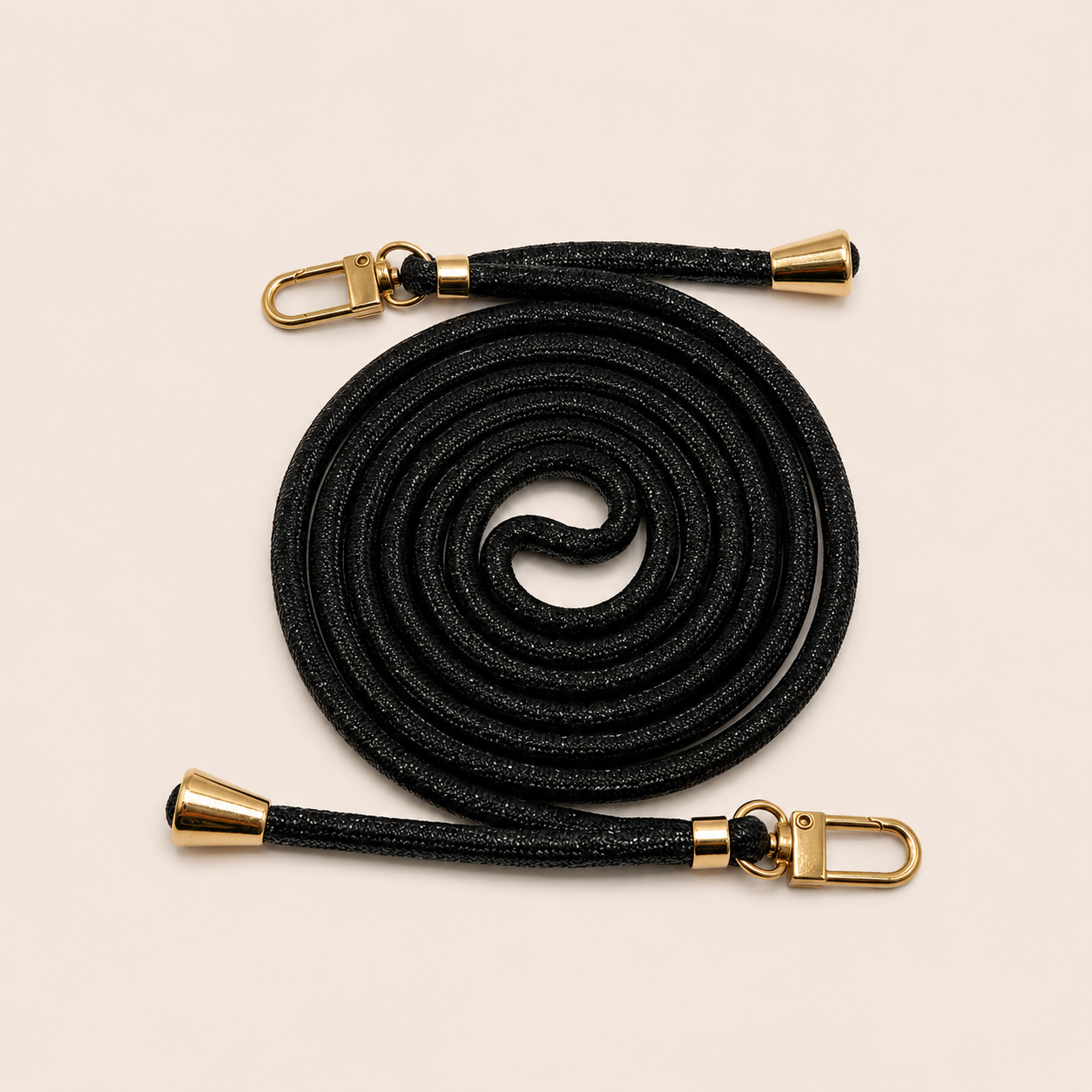 Black Shimmery PHONE CORD with a metallic sheen, coiled with gold hardware, shown as a flat lay.