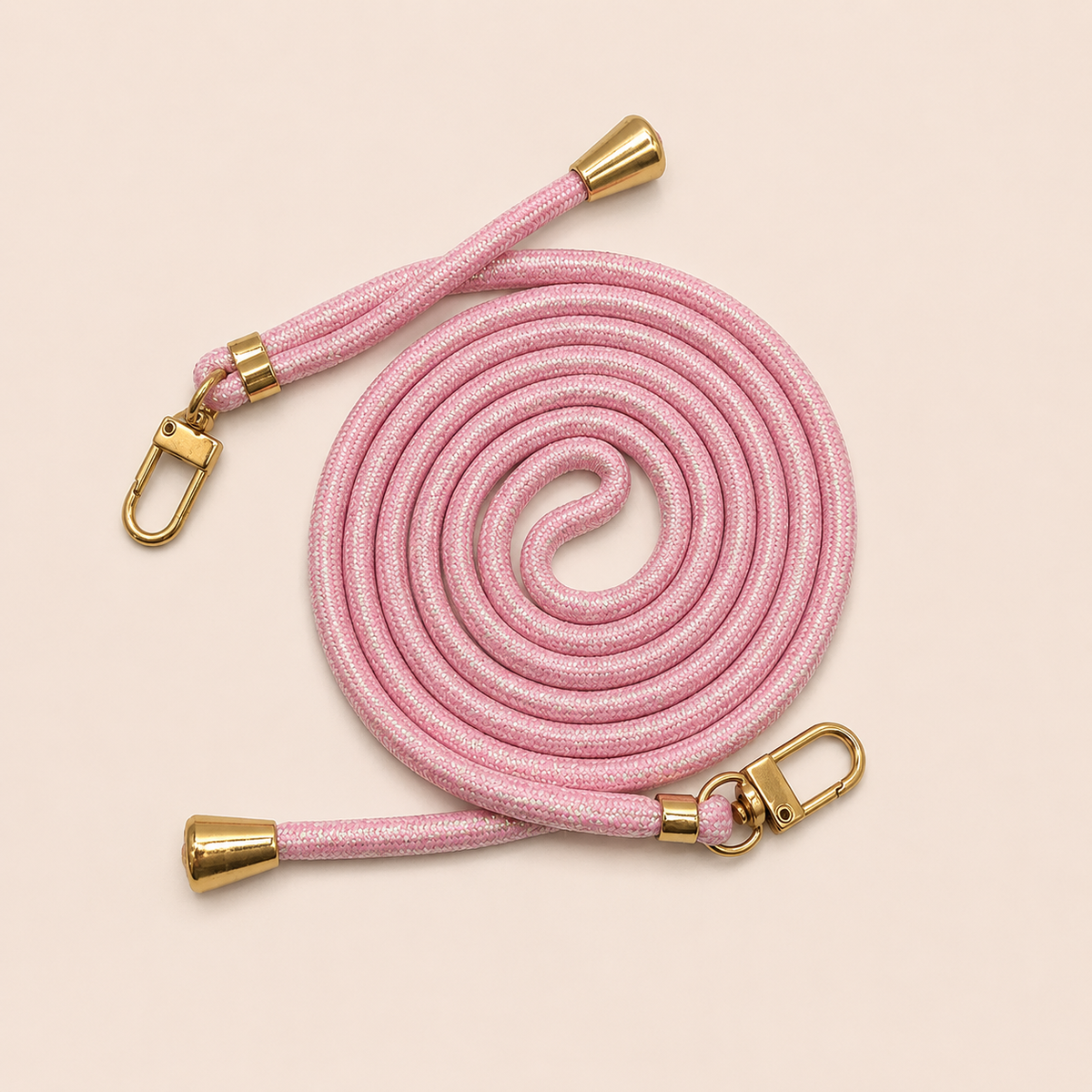 Pink Shimmery PHONE CORD with a metallic sheen, coiled with gold hardware, shown as a flat lay.