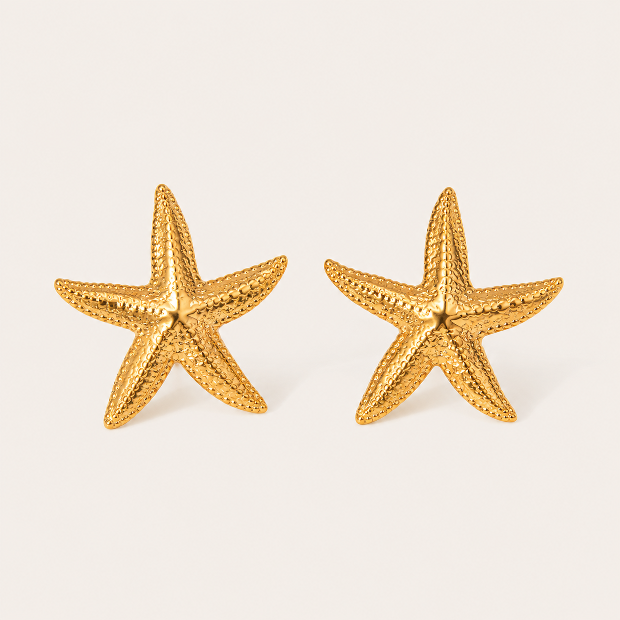 Gold textured starfish-shaped stud earring with a beaded dotted surface — Folie à Trois Siesta EARRINGS.