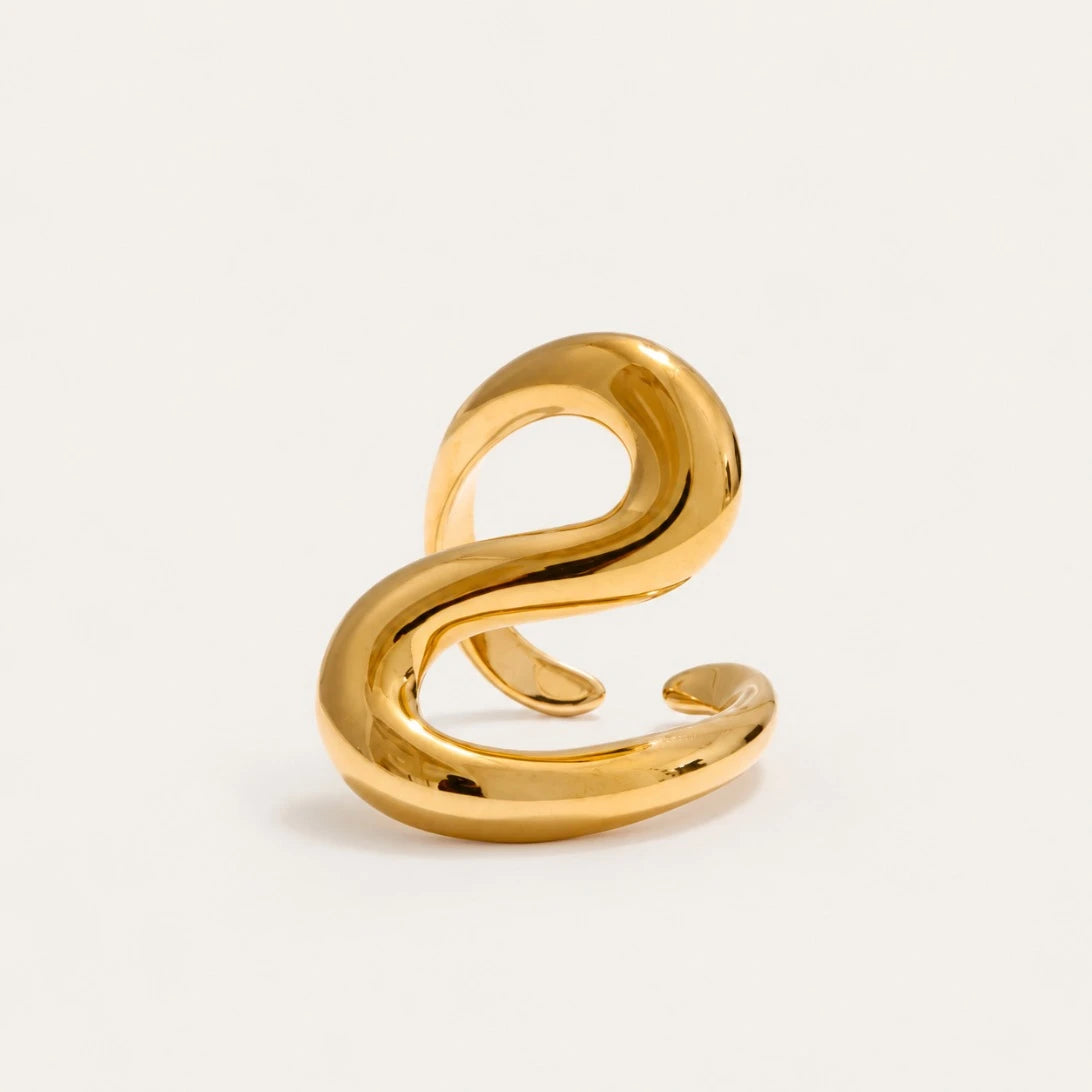 Gold Sinuosa RING: a thick, rounded open band that curls into a soft S-curve — Folie à Trois