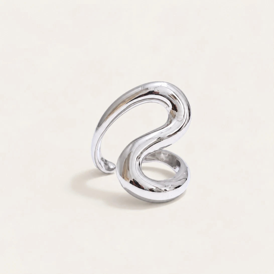 Silver-tone Sinuosa RING: a thick, rounded open band that curls into a soft S-curve — Folie à Trois